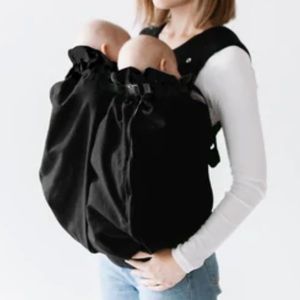 New, never been used black twins weego baby carrier